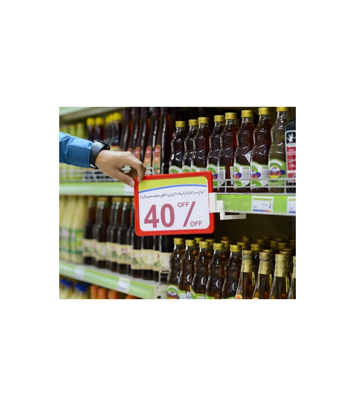 اتیکت مگنوم پاور با تخفیف 40 درصدی بر روی قوطی‌های شربت در فروشگاه.